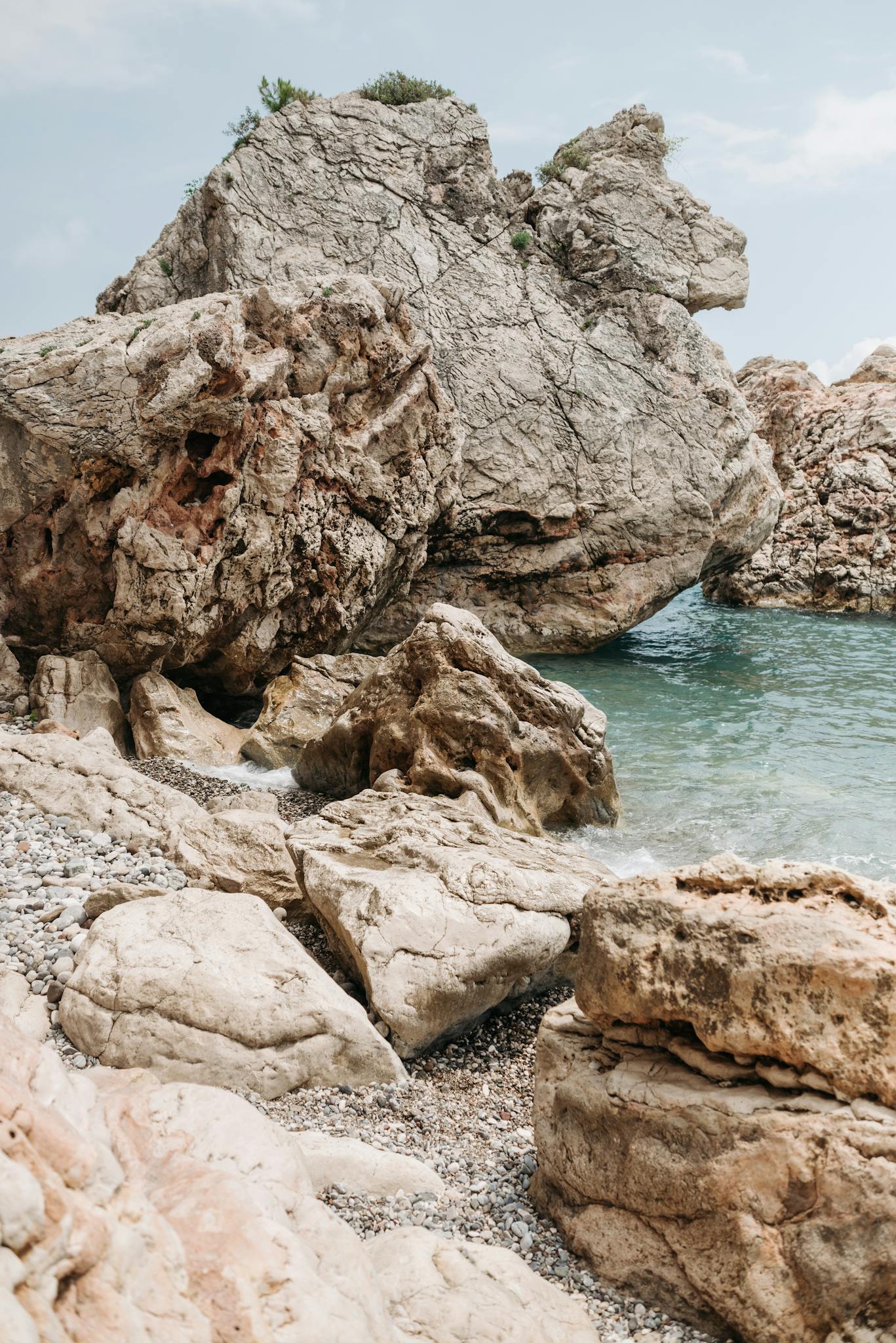 Captivating rock formations on a tranquil shore, perfect for nature lovers seeking tranquility.